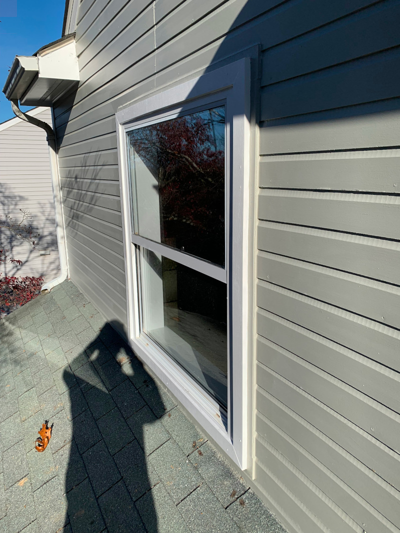 Completed exterior window trim repair with new HardieBoard and MiraTEC trim