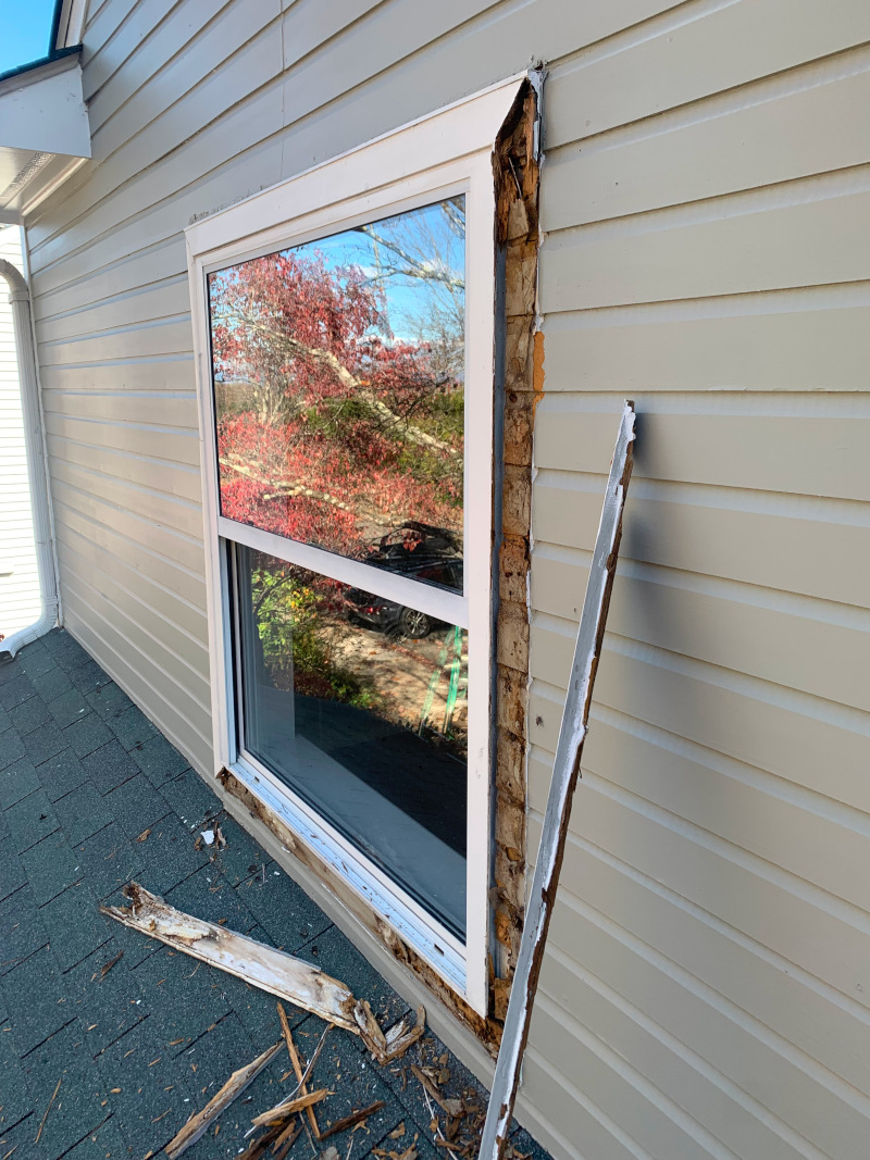 Trim removed showing deteriorated siding