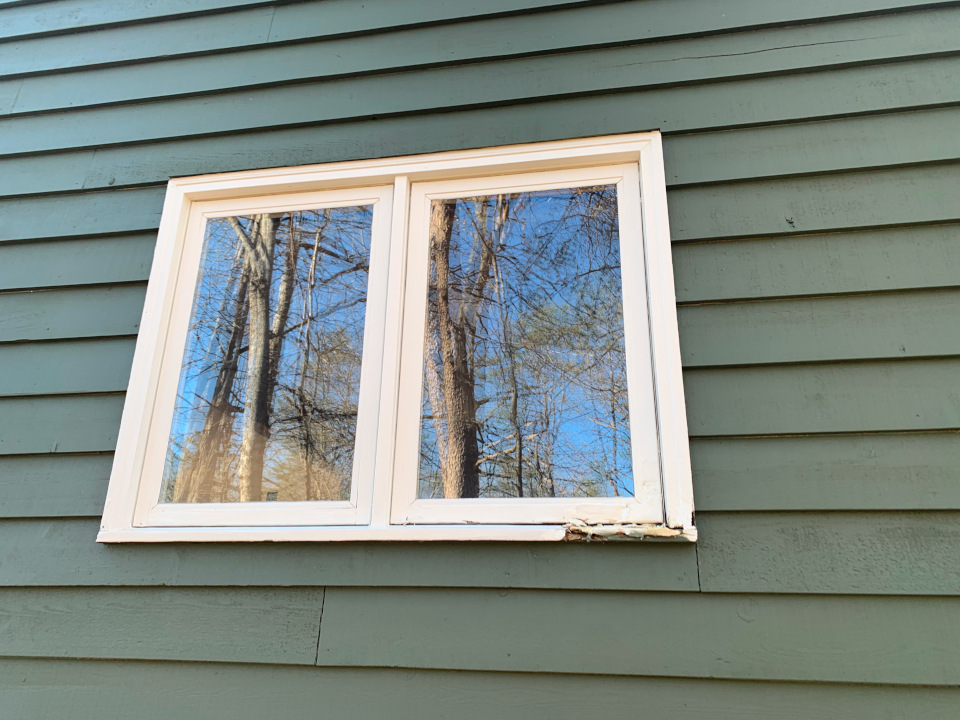 Before: the window shows visible rot on the trim, especially along the lower right section.