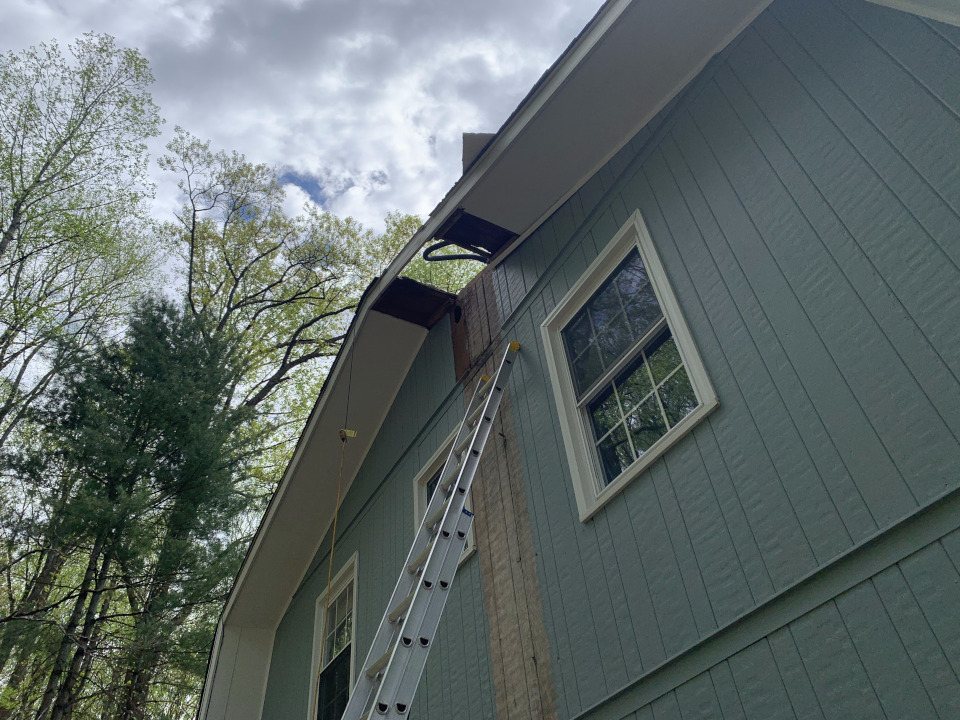 Additional soffit material around the opening was removed due to rot.