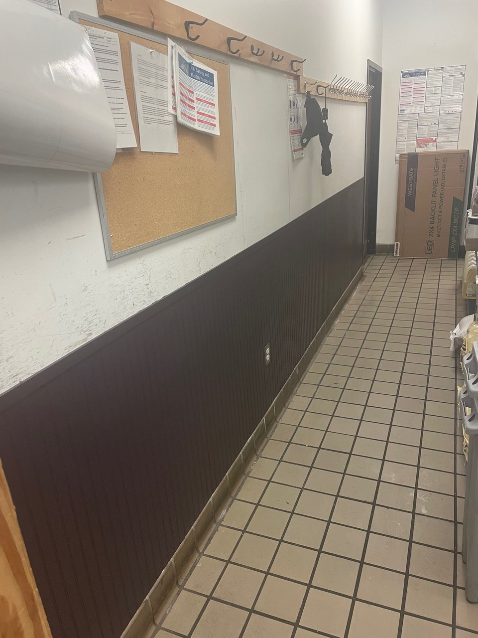 Fully installed and painted wainscoting with plum color paint and clean lines.