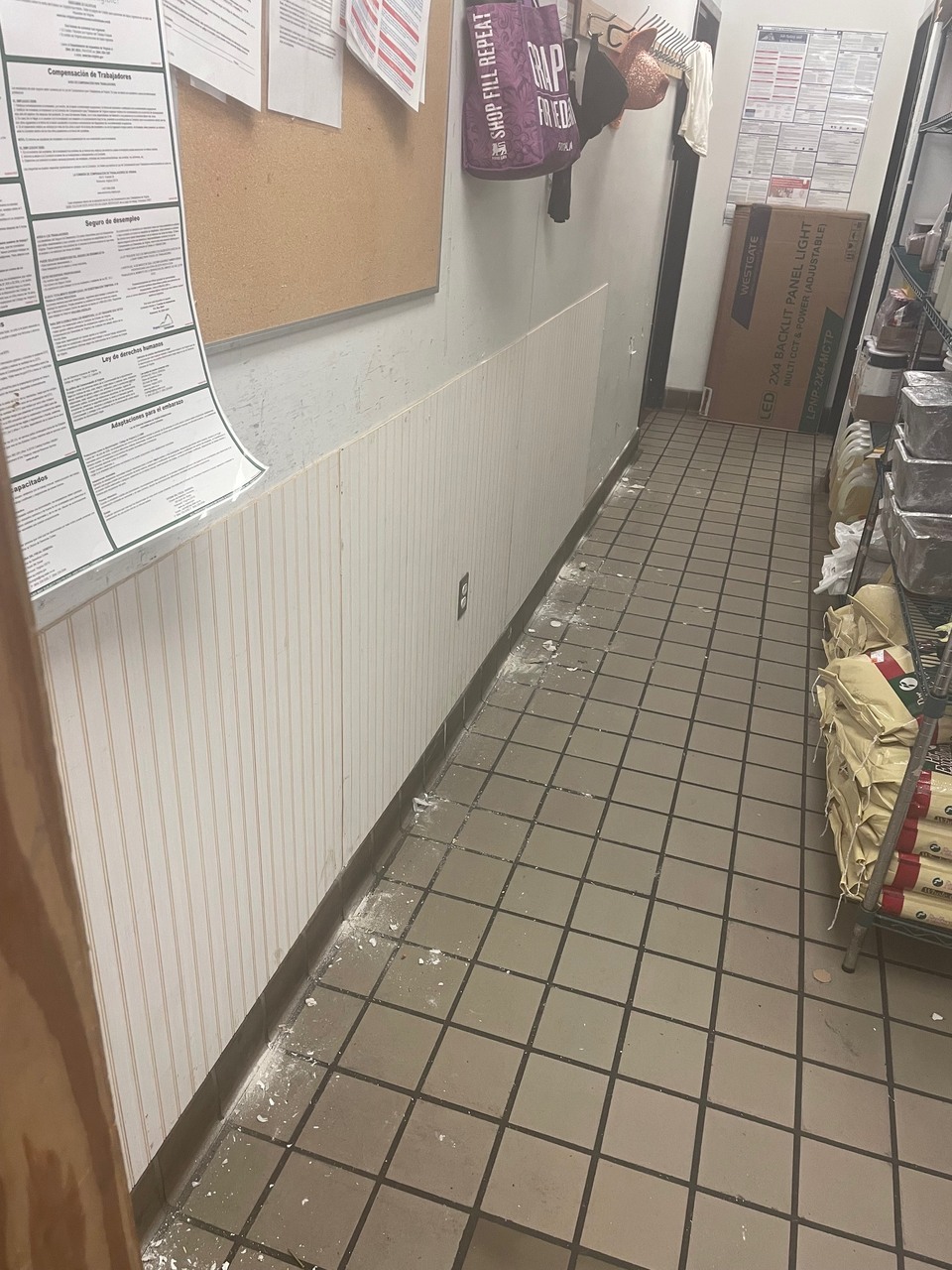 Partially installed wainscoting showing careful receptacle integration carpentry work.