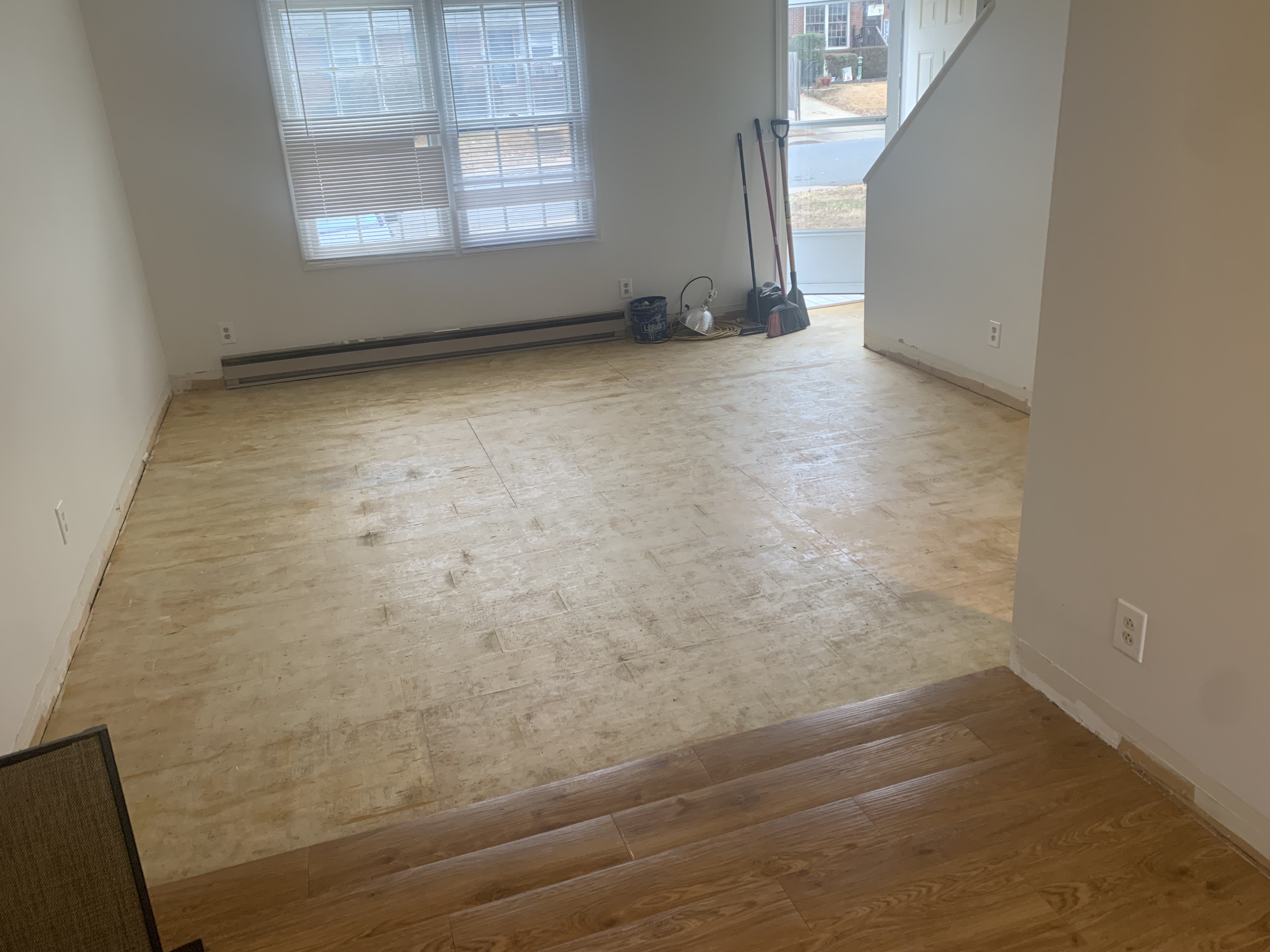 Flooring removed exposing subfloor